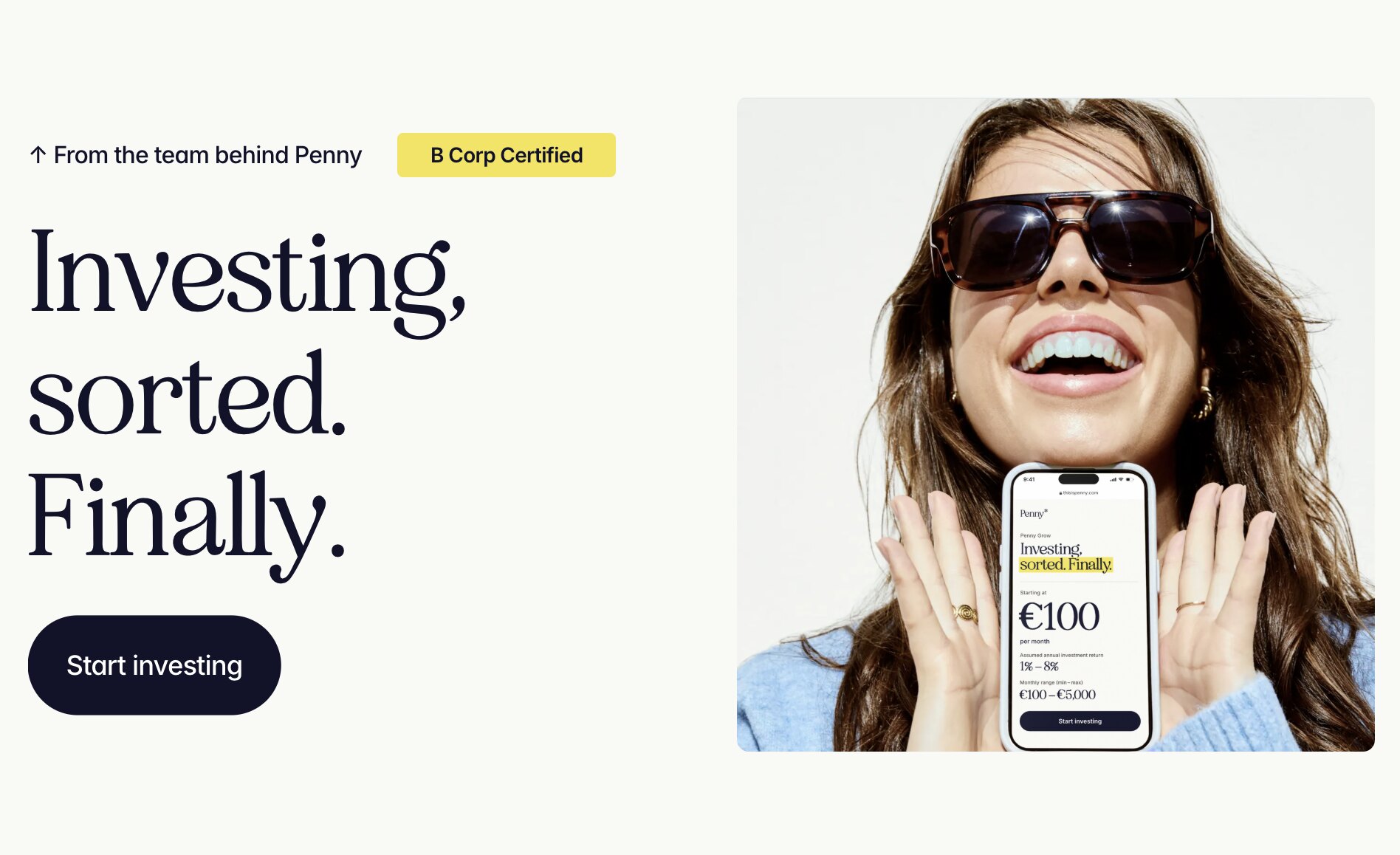 Penny Grow: Investing, sorted. Finally. — a smiling woman holding a phone showing Penny Grow, starting at €100 a month